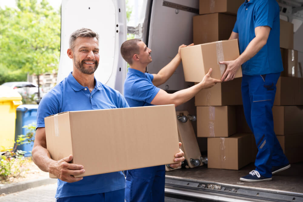 Watsonville Movers Loading Household Items Into A Moving Truck
